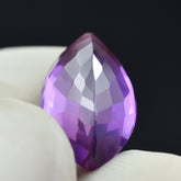 Natural flawless purple sapphire, 9.56 carats, a marquise-cut gemstone for jewelry making.